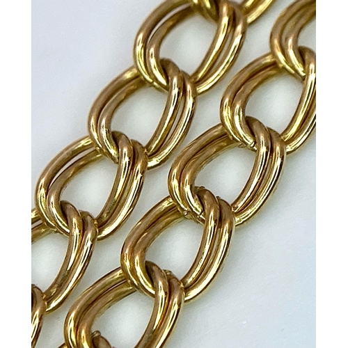 618 - A 9K Yellow Gold Curb Link Bracelet with Heart Clasp. 4.83g weight. 18cm.