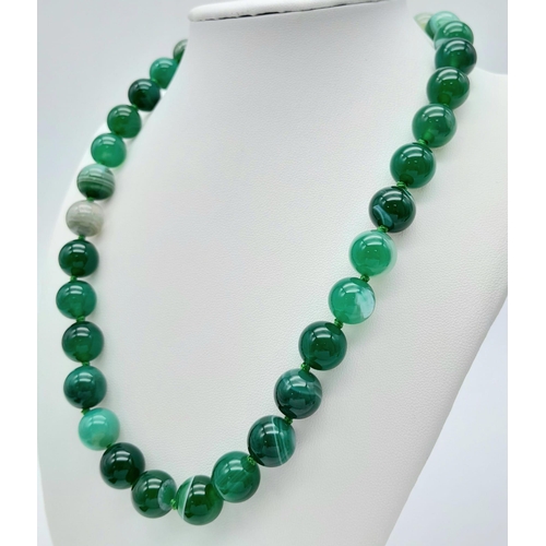 1037 - A Green Striped Agate Bead Necklace. 12mm beads. 44cm length.