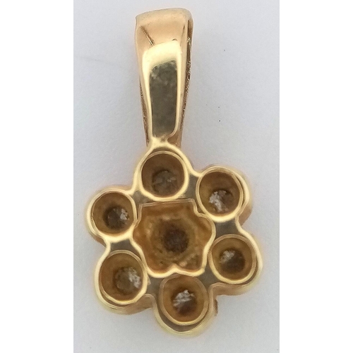 1262 - A Small 9K Yellow Gold Diamond Floral Pendant. 12mm. 0.6g weight.