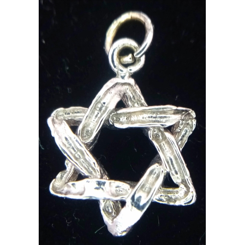 1494 - A 9K White Gold Star of David Pendant. 2cm. 1.5g weight.