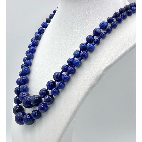 478 - A Two Strand Lapis Lazuli Graduating Bead Necklace. 7-14mm. 44cm necklace length.