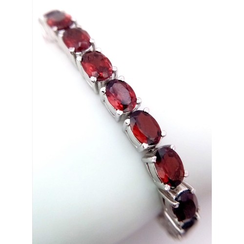 52 - A Hessonite Garnet Gemstone Tennis Bracelet set in 925 Silver. 24.2g total weight. 18cm. Ref: HV -21... 