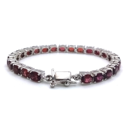 52 - A Hessonite Garnet Gemstone Tennis Bracelet set in 925 Silver. 24.2g total weight. 18cm. Ref: HV -21... 