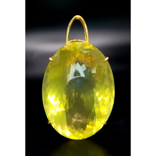 66 - An Oval Shape Brazilian Lemon Quartz Pendant set in Gold Plated 925 Silver. Weight - 34.50g. Lemon Q... 