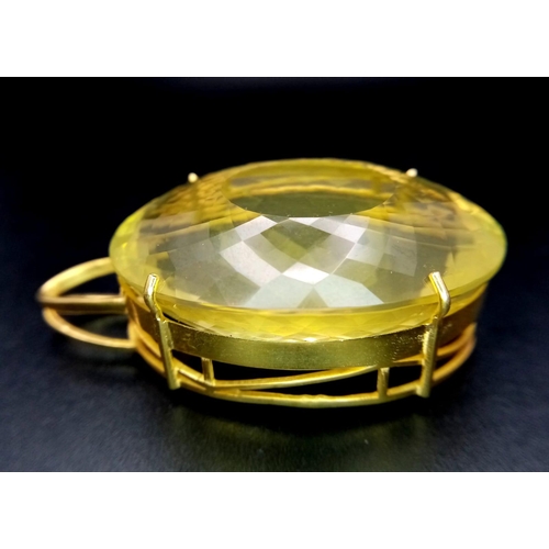 66 - An Oval Shape Brazilian Lemon Quartz Pendant set in Gold Plated 925 Silver. Weight - 34.50g. Lemon Q... 