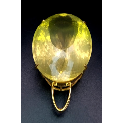 66 - An Oval Shape Brazilian Lemon Quartz Pendant set in Gold Plated 925 Silver. Weight - 34.50g. Lemon Q... 