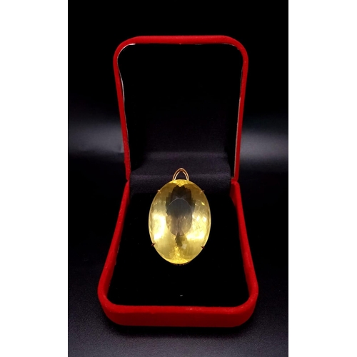 66 - An Oval Shape Brazilian Lemon Quartz Pendant set in Gold Plated 925 Silver. Weight - 34.50g. Lemon Q... 