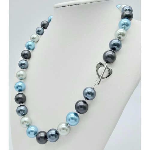 815 - A Blue and Shades of Metallic Silver Tone South Sea Pearl Shell Necklace. 12mm beads. 44cm length.