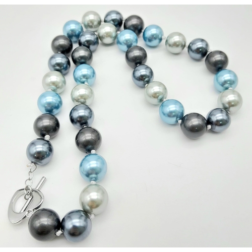 815 - A Blue and Shades of Metallic Silver Tone South Sea Pearl Shell Necklace. 12mm beads. 44cm length.