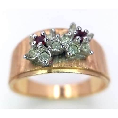 890 - An 18K Yellow Gold Garnet and Diamond Ring. Two small garnets with diamond surrounds. Size N. 3.7g w... 