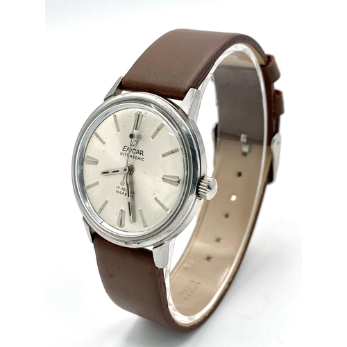 1002 - A Vintage Enicar Mechanical Gents Watch. Brown leather strap. Stainless steel case - 34mm. Silver to... 