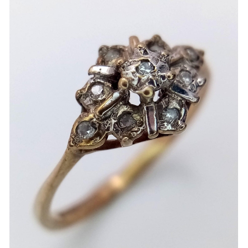 1271 - A Vintage 9K Yellow Gold Diamond Cluster Ring. Size H. 1.05g weight.