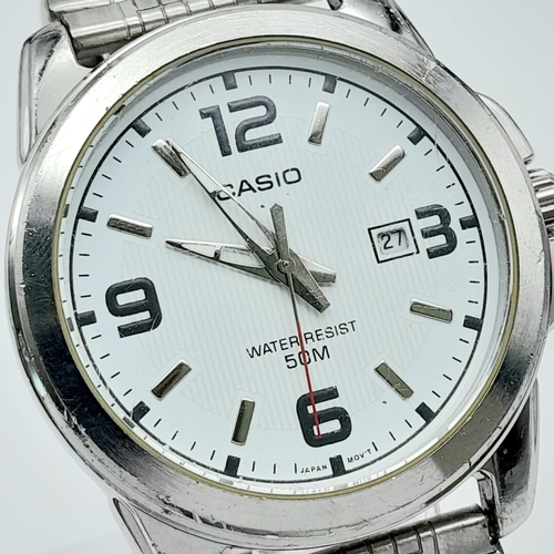 1418 - A Casio Quartz Gents Watch. Stainless steel bracelet and case - 43mm. White dial with date window. I... 