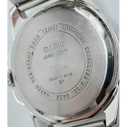 1418 - A Casio Quartz Gents Watch. Stainless steel bracelet and case - 43mm. White dial with date window. I... 