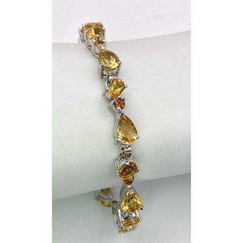 485 - A Rich Citrine Gemstone Tennis Bracelet set in 925 Silver. 19cm length. Weight - 19 gm. Ref: HV-2166