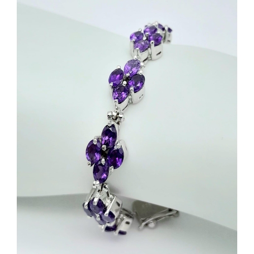 505 - A Brazilian Amethyst Tennis Bracelet set in 925 Silver. Weight - 30.20g. Lucky clover pattern. 19cm ... 