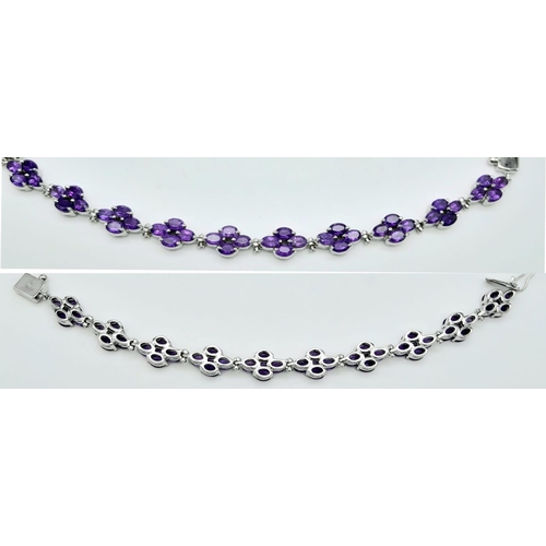 505 - A Brazilian Amethyst Tennis Bracelet set in 925 Silver. Weight - 30.20g. Lucky clover pattern. 19cm ... 