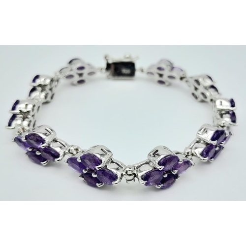 505 - A Brazilian Amethyst Tennis Bracelet set in 925 Silver. Weight - 30.20g. Lucky clover pattern. 19cm ... 