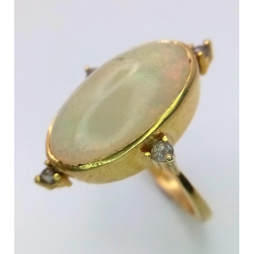 562 - A 4.5ct Oval Ethiopian Fire Opal and Diamond Gold Plated 925 Silver Ring. Size M. 4.4g total weight.... 