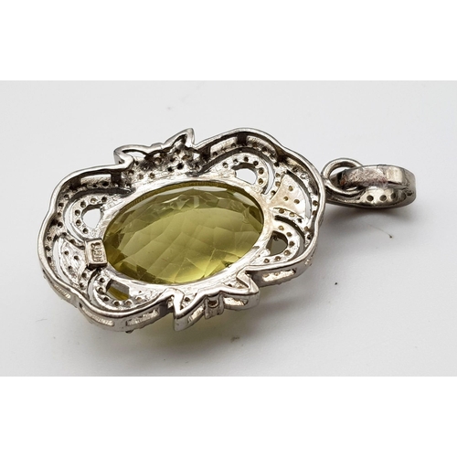 933 - An Oval Faceted Lemon Quartz and Diamond Art Deco Style Pendant set in 925 Silver. 4cm. Weight - 7.5... 