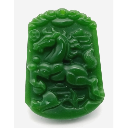 946 - A Chinese Green Jade Decorative Horse Pendant. 4.5cm x 3cm