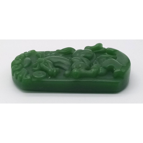 946 - A Chinese Green Jade Decorative Horse Pendant. 4.5cm x 3cm