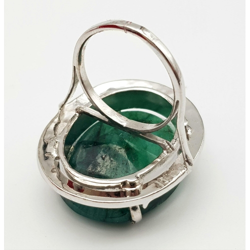 1191 - An Oval Shaped Brazilian Emerald 925 Silver Ring. Size P. Weight - 18.80g. Comes in a presentation c... 