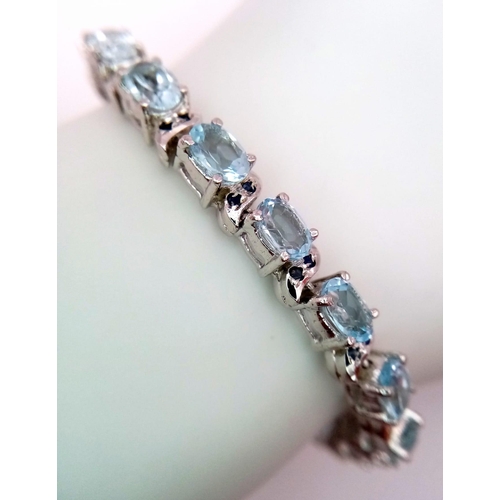 122 - An Ice Blue Topaz Gemstone Tennis Bracelet set in 925 Silver. Weight - 25.30g. 18cm length. Ref: HV-... 