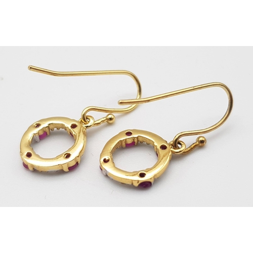 1285 - A Pair of 18K Gold (tested) Ruby and Diamond Circle Drop Earrings. 1.22g weight