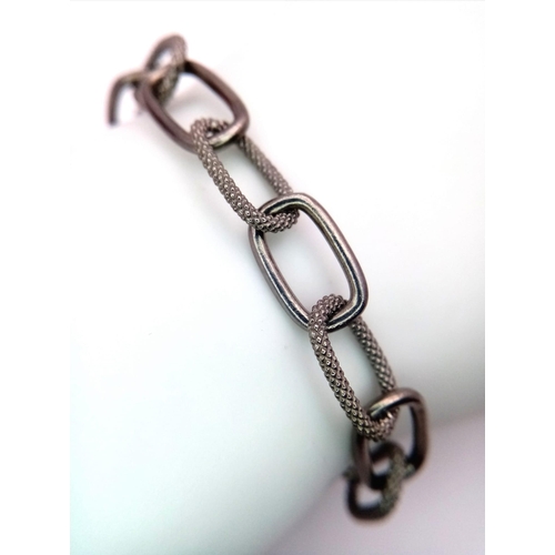 1355 - A 925 Silver Elongated Link Bracelet. Weight - 13.5 gm. 18cm. Comes with a presentation case. Ref: H... 