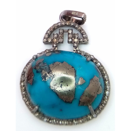 659 - A Turquoise Cabochon and Diamond Pendant set in 925 Silver. Beautiful large cabochon with a diamond ... 