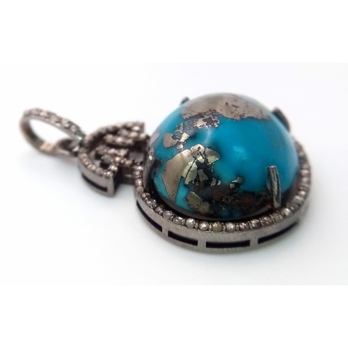 659 - A Turquoise Cabochon and Diamond Pendant set in 925 Silver. Beautiful large cabochon with a diamond ... 