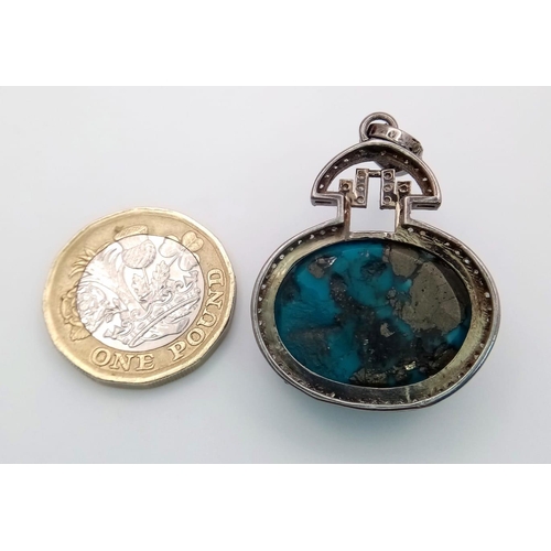 659 - A Turquoise Cabochon and Diamond Pendant set in 925 Silver. Beautiful large cabochon with a diamond ... 