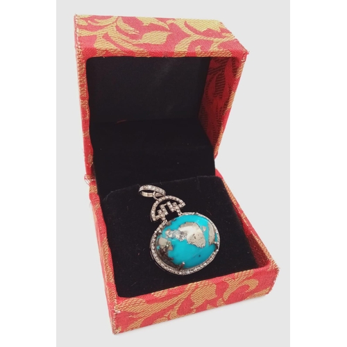 659 - A Turquoise Cabochon and Diamond Pendant set in 925 Silver. Beautiful large cabochon with a diamond ... 