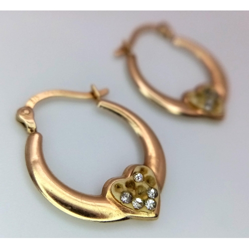 688 - A Pair of 9K Yellow Gold Heart Hoop Earrings. 0.85g weight.