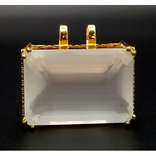 694 - A Rectangular Shaped Rose Quartz Gemstone Pendant set in Gold Plated Silver - With diamond accents. ... 