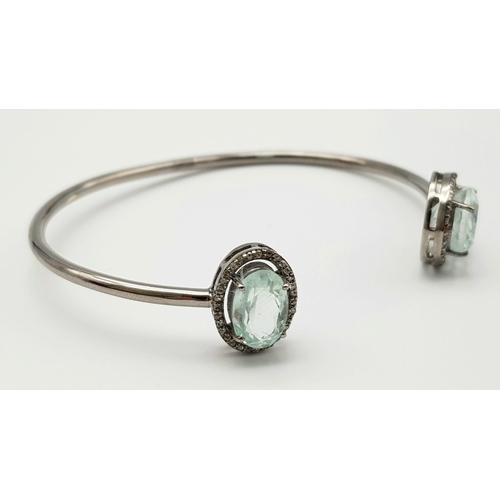 863 - An Aquamarine and Diamond Cuff Bracelet.  Aquamarine - 8 ctw.  Diamonds - 0.50ctw. Set in sterling s... 