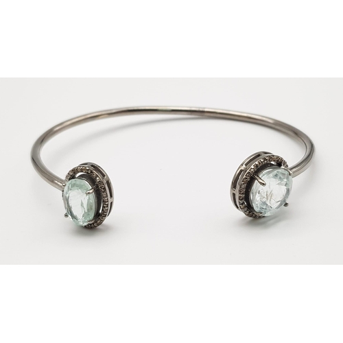 863 - An Aquamarine and Diamond Cuff Bracelet.  Aquamarine - 8 ctw.  Diamonds - 0.50ctw. Set in sterling s... 