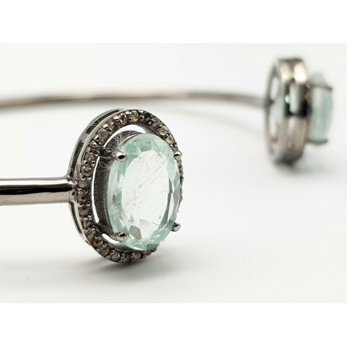 863 - An Aquamarine and Diamond Cuff Bracelet.  Aquamarine - 8 ctw.  Diamonds - 0.50ctw. Set in sterling s... 