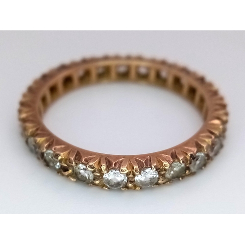 885 - A Vintage 9K Yellow Gold White Stone Eternity Ring. Size O. 2.75g total weight.