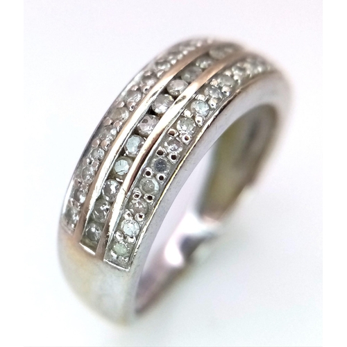 1338 - An 18K White Gold Diamond Three Row Half Eternity Ring. 0.34ctw of diamonds. Size L. 3.5g total weig... 