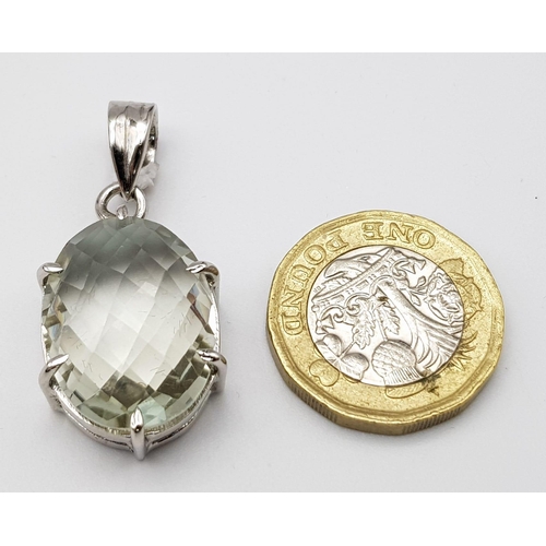 1334 - An Oval Brazilian Green Amethyst 925 Silver Pendant. A faceted 25ct Amethyst. 3cm. Comes with a pres... 