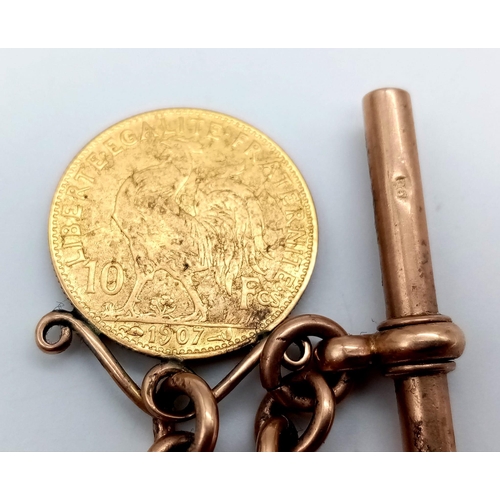 136 - An Antique 9K Rose Gold Albert Chain with Spinning Fob Gold (900 purity) 10 Franc Coin. 45cm length.... 