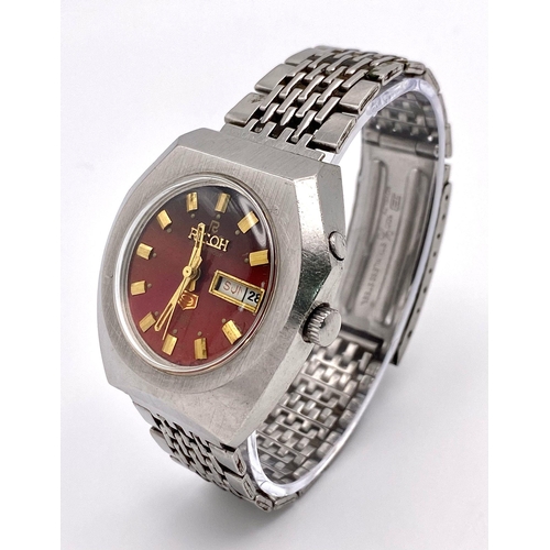 527 - A Vintage Ricoh 21 Jewels Automatic Gents Watch. Stainless steel bracelet and case - 37mm. Red dial ... 