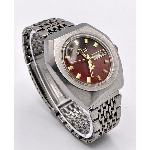 527 - A Vintage Ricoh 21 Jewels Automatic Gents Watch. Stainless steel bracelet and case - 37mm. Red dial ... 