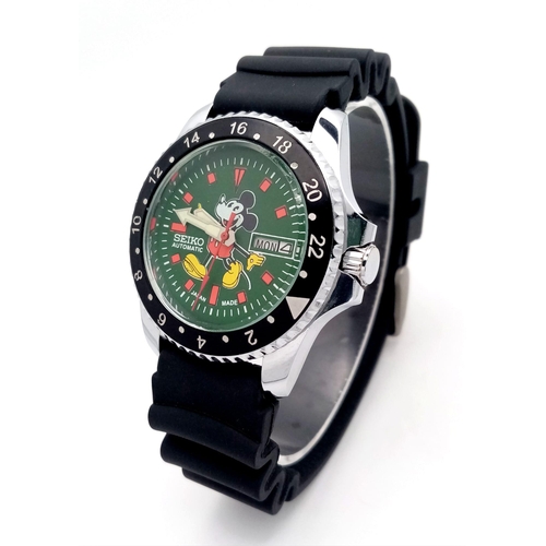 535 - A Seiko Automatic Mickey Mouse Watch. Black rubber sport strap. Stainless steel case with black beze... 