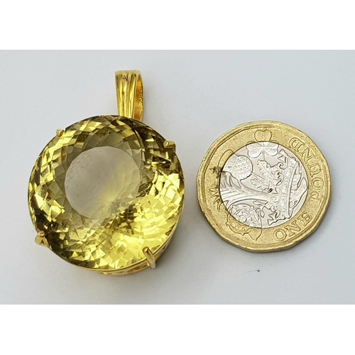 703 - A Round Lemon Quartz Pendant set in Gold Plated 925 Silver. Weight - 20g.  Lemon Quartz - 66.65ct. C... 