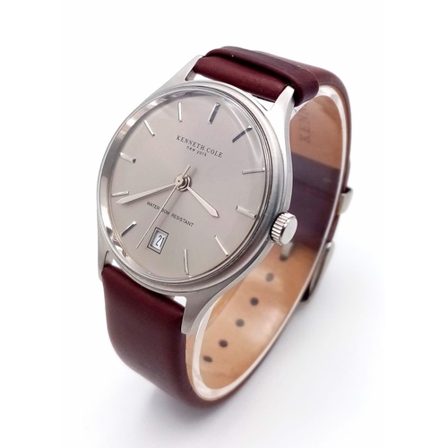 774 - A New (Ex Display) Kenneth Cole, New York Date Watch. Stainless Steel Case, Brown Leather Strap. 36m... 