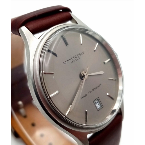 774 - A New (Ex Display) Kenneth Cole, New York Date Watch. Stainless Steel Case, Brown Leather Strap. 36m... 