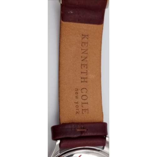 774 - A New (Ex Display) Kenneth Cole, New York Date Watch. Stainless Steel Case, Brown Leather Strap. 36m... 